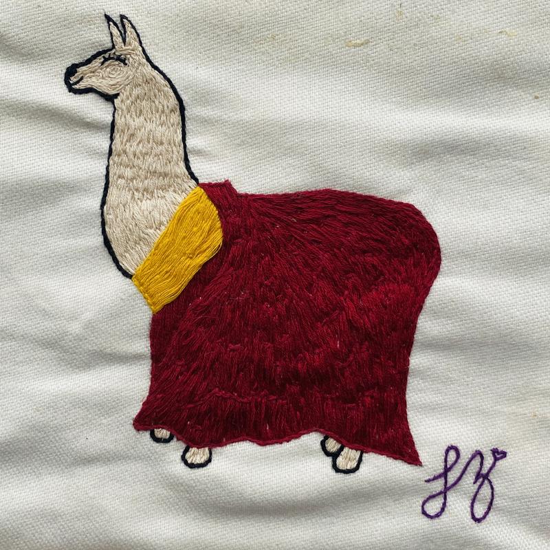 A reverent llama dressed in the traditional dress of his Holiness the Dalai Lama.