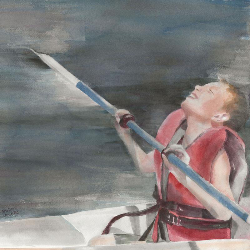 My nephew kayaking on the lake on a beautiful day.