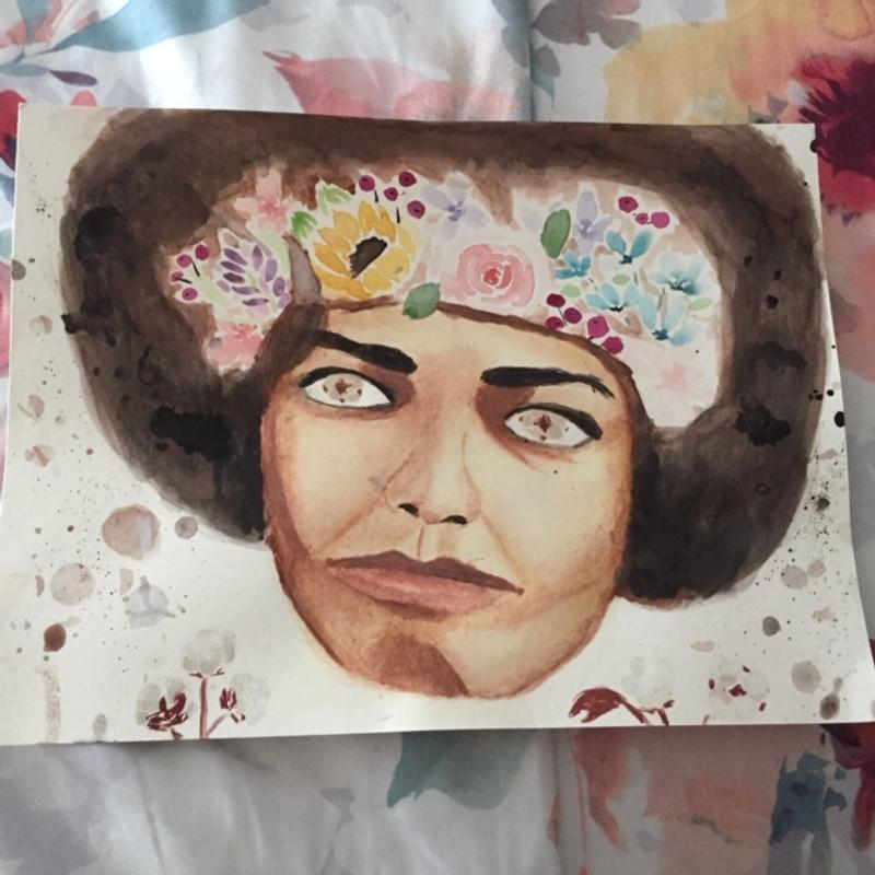 A portrait of Angela Davis, depicting flowers on and around her.